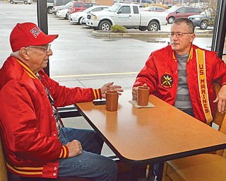 Jack Kidd, left, and Ken Jakubec, both of Austintown, have coffee at Panera Bread there. The Panera Bread and O’Charley’s restaurants owned by Covelli Enterprises will honor veterans like them with special meal deals Tuesday. Also offering Veterans Day deals will be Applebee’s, Handel’s Homemade Ice Cream, Hollywood Gaming at Mahoning Valley Race Course, Great Clips and a list of other businesses.