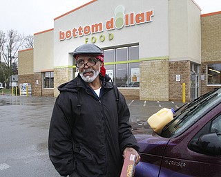        ROBERT K. YOSAY  | THE VINDICATOR..Bottom Dollar...  closing by years end..Rev Chris London stopping on his way home from work will miss the store..-30-.