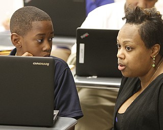        ROBERT K. YOSAY  | THE VINDICATOR..Discovery at Volney 3- 8th grade - .. Checking on Math with Mathia Rubic 6th grader and the principal Misha Scott..-30-.