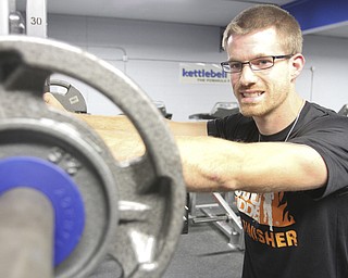 William D. Lewis the Vindicator Mudder Chad Macek trains at Kettleball fitness in niles.