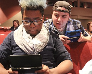 William D Lewis the Vindicator Chaney student Nico Mostella, 12 th grade, left, and Canfield 12 th grader Jonathan Palermo take a break during 11-6-14 rehersal for Ragtime.