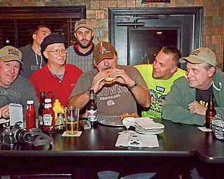Burger Guyz crowd around Fast Freddie from 93.3 the Wolf at The Pour House Bar and Grill in Canfield. From left to right in front, Scott Long, Anthony Fuda, Fast Freddie, Jim Murphy, JT Tranovich. Back row Eric Tranovich and James Chizmark.