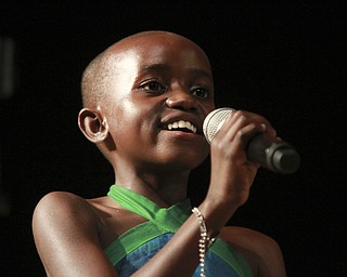 William DLewis the Vindicator  SRebecca Tendo sings Amazing Grace with African children's Choir during 11-13-14 performance at  Powers Auditorium in Youngstown.