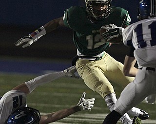 Akron St. Vincent-St. Mary wide receiver Markus Hurd (right) breaks away from the tackle of Poland defender Tyler Smith during first quarter action in their Division III Region 7 high school playoff football game at Lake High School on Friday, Nov. 14, 2014, in Uniontown, Ohio. (Ed Suba Jr./Akron Beacon Journal)