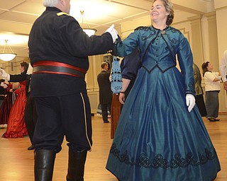 Katie Rickman | The Vindicator .Ron Orkis dances with his wife Dr. Holly Ray, both of Chardon, Ohio as the band plays the Lancer's Quadrille 1st Figure during The Governor David Tod Civil War Ball at the Tyler History Center in Youngstown on Saturday, Nov. 1, 2014.