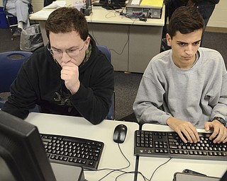 Katie Rickman | The Vindicator.Cole Baird, 17, on left and Stevin Vician, 17 work on a speech that they will be giving with classmates during the Veteran's Day program on Friday Nov. 7, 2014 at Lowellville High School.
