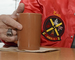 Katie Rickman | The Vindicator.Ken Jackubec of Austintown wears his Marine insignia ring and sips coffee at the Panera Bread in Austintown on Friday, Nov. 7, 2014.