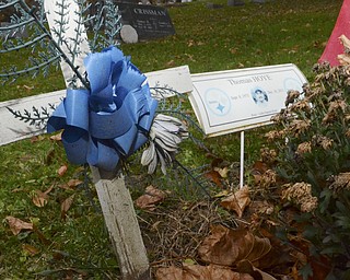 Katie Rickman | The Vindicator.The temporary marker at the grave of Thomas Hoye in Lowellville on Saturday, Nov. 8, 2014.  There is a benefit to help raise money for a tombstone for the grave because they family has not been able to afford one.
