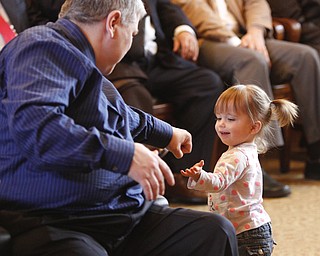        ROBERT K. YOSAY  | THE VINDICATOR..Trumbull County Court annual Adoption Day...Fist bump after official adoption was Abby marie Dutting and John Dutting...(dad)