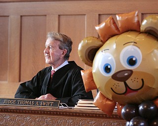        ROBERT K. YOSAY  | THE VINDICATOR..Trumbull County Court annual Adoption Day...Judge Thomas Swift presided...  as a baloon lion stood guard