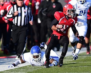 YOUNGSTOWN, OHIO - NOVEMBER 15, 2014:Andre Stubbs #4 of YSU runs up the sideline after avoiding a tackle from Kendall Walker #11 of Indiana State during the 1st half of Saturday afternoons game at Stambaugh Stadium. (Photo by David Dermer/Youngstown Vindicator)