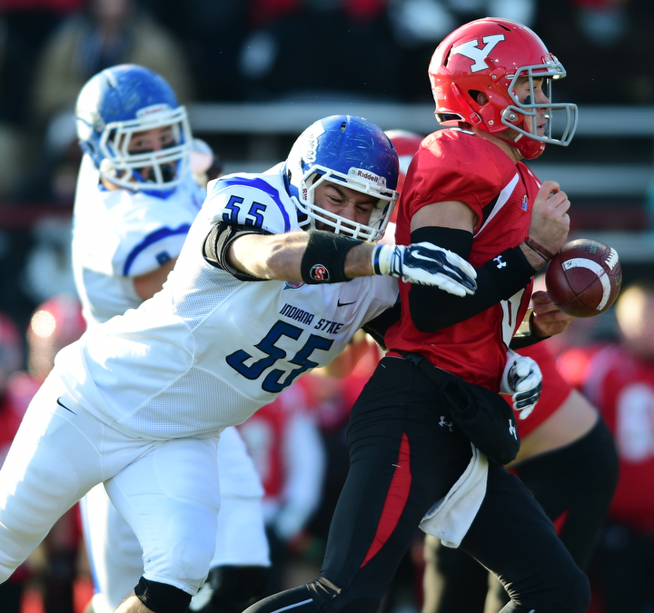 YOUNGSTOWN, OHIO - NOVEMBER 15, 2014: Hunter Wells #6 of YSU fumbles the football while being sacked by Connor Underwood #55 of Indiana State during the 1st half of Saturday afternoons game at Stambaugh Stadium. (Photo by David Dermer/Youngstown Vindicator)