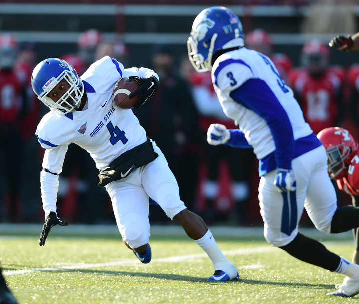 YOUNGSTOWN, OHIO - NOVEMBER 15, 2014: Gary Owens #4 of Indiana state tuns upfield for extra yardage after a reception during the 1st half of Saturday afternoons game at Stambaugh Stadium. (Photo by David Dermer/Youngstown Vindicator)