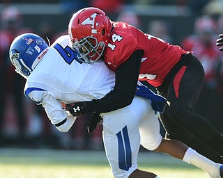 YOUNGSTOWN, OHIO - NOVEMBER 15, 2014: Gary Owens #4 of Indiana State is tackled by Eric Thompson #14 of YSU during the 1st half of Saturday afternoons game at Stambaugh Stadium. (Photo by David Dermer/Youngstown Vindicator)