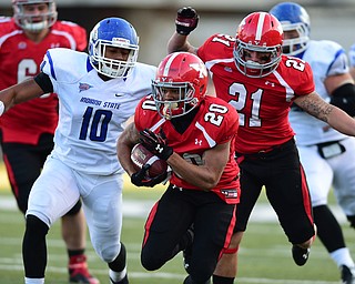YOUNGSTOWN, OHIO - NOVEMBER 15, 2014: Jody Webb #20 of YSU runs the football downfield after picking up a block from Ryan Moore #21 on Kendall Walker #10 of Indiana State during the 2nd half of Saturday afternoons game at Stambaugh Stadium. (Photo by David Dermer/Youngstown Vindicator)