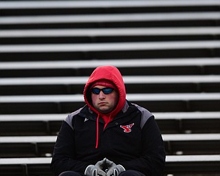YOUNGSTOWN, OHIO - NOVEMBER 15, 2014: A unnamed YSU football fits alone in the stands during the 2nd half of Saturday afternoons game at Stambaugh Stadium. (Photo by David Dermer/Youngstown Vindicator)