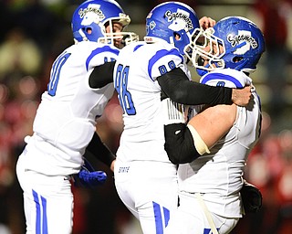 YOUNGSTOWN, OHIO - NOVEMBER 15, 2014: Eric Heidorn #98 of Indiana State is congratulated by teammates Trent Lancaster #10 and Lafaele Fautanu #8 after kicking the game winning field goal in overtime of Saturday afternoons game at Stambaugh Stadium. (Photo by David Dermer/Youngstown Vindicator)