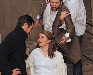 Luis Alejandro Orozco (far left) of El Passo TX comes onto Danielle Messina (middle left) of Poughkeepsie NY while Michael Young (middle right) of Cortland is being held back from stopping them by Luke Scott of Long Island NY during a dress rehearsal of "Don Giovanni" at Stambaugh Auditorium in Youngstown on Thursday afternoon.   Dustin Livesay  |  The Vindicator  11/7/14  Stambaugh Auditorium