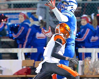 Jeff Lange | The Vindicator  Western Reserve's Joe Falasca (back) looks to catch a pass over the defense of Lucas' Sam Davis during first quarter action in Orrville, Friday night.