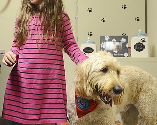 Katie Rickman | The Vindicator. Briley Chance, 8 stands next to Asher in the guidance office at Jackson Milton Elementary School on Saturday, Nov. 15.