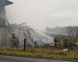        ROBERT K. YOSAY  | THE VINDICATOR..a barn fire destroyed a barn on Harbor EdinburgRd in Lawrence county as area firefighters responded to the fire including the Poland Fire Dept that brought its aerial truck