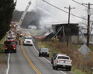        ROBERT K. YOSAY  | THE VINDICATOR..a barn fire destroyed a barn on Harbor EdinburgRd in Lawrence county as area firefighters responded to the fire including the Poland Fire Dept that brought its aerial truck