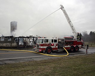        ROBERT K. YOSAY  | THE VINDICATOR..a barn fire destroyed a barn on Harbor EdinburgRd in Lawrence county as area firefighters responded to the fire including the Poland Fire Dept that brought its aerial truck