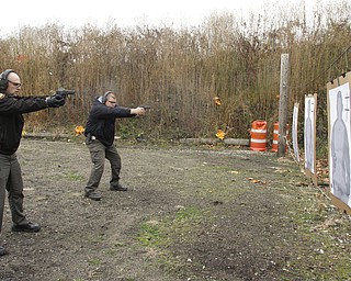        ROBERT K. YOSAY  | THE VINDICATOR..Fraternal Order of Police Lodge 141 set up this firing range for firearms training and qualification for the sheriffÕs deputies it represents off of West Ave.. B. J. Alan Fireworks donated the land and YSU donated the earth for the bullet backstops behind the targets, ..Taking practice is Todd Mariani closest and Sgt Steven Lindow..