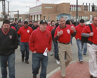 William D Lewis the vindicator  Y-town firefighters and firefighters from other departments march to city hall to protest reduction of # of firefighters in city. 2nd from left is local 312 pres dave cook.