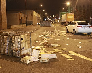 William D. Lewis the Vindicator Postal workers and concerned citizens help clean up a truck load of mail that spilled from a truck on Front St in downtown Y-town Wed. night.