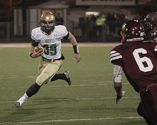  .          ROBERT  K. YOSAY | THE VINDICATOR..Ursulines #39  Vito Penza picks out a hole as Libertys #6  Lynn Bowden looks on ....Ursuline Irish vs Liberty Leopards at Mollenkof Stadium...-30-