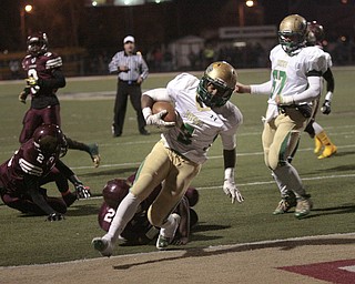  .          ROBERT  K. YOSAY | THE VINDICATOR..Ursulines #3 Kimauni Johnson runs into the endzone for the Irish first score on a three yard run  as #21 Junior Blair #2 JaShaun Whitman fall down   Uruslines #67 Dante Cerimele looks on..Ursuline Irish vs Liberty Leopards at Mollenkof Stadium...-30-