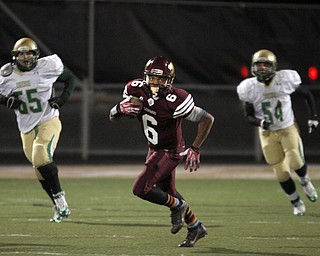  .          ROBERT  K. YOSAY | THE VINDICATOR..Libertys #6 Lynn Bowden breaks out in the open as Ursulines #55 Giacamo Cappablanca and #54 Tyler Leonard chase.. as he got a first down..Ursuline Irish vs Liberty Leopards at Mollenkof Stadium...-30-