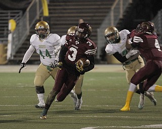  .          ROBERT  K. YOSAY | THE VINDICATOR..iberty #3 Ben Phillips breaks out of the backfield during first quarter action as ursulines #44Spencer Warren and #14 (hidden) Dakota Hobbs give chase.. Blocking #4 Libertys Kaylon Davis  on #10 Dawalyn Washington for Ursuline..Ursuline Irish vs Liberty Leopards at Mollenkof Stadium...-30-