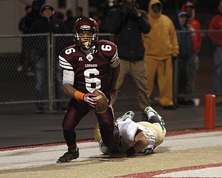  .          ROBERT  K. YOSAY | THE VINDICATOR..Ursulines #65  Devin Matthews pursues #6 Lynn Bowden as Bowden steps out of bounds in the endzone for two points for Ursuline late in second quarter..Ursuline Irish vs Liberty Leopards at Mollenkof Stadium...-30-