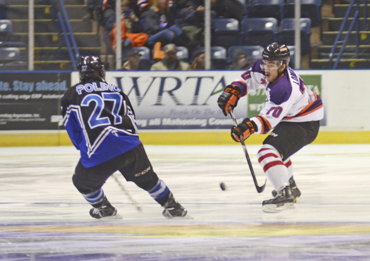 Katie Rickman | The Vindicator.Phantom's Ryan Lomberg (#70) moves up the ice as Lincoln Star's Patrick Polino (#27) attempts to block him during the first period at the Covelli Centre on Sunday, Nov. 16, 2014. Phantoms lost to the Lincoln Stars 3-4 in over time.