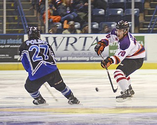 Katie Rickman | The Vindicator.Phantom's Ryan Lomberg (#70) moves up the ice as Lincoln Star's Patrick Polino (#27) attempts to block him during the first period at the Covelli Centre on Sunday, Nov. 16, 2014. Phantoms lost to the Lincoln Stars 3-4 in over time.