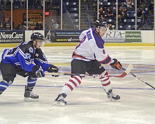 Katie Rickman | The Vindicator.Lincoln Stars Max Humitz (#12) attempts to steal from Phantom's Josh Melnick (#8) during the second period at the Covelli Centre on Sunday, Nov. 16, 2014. Phantoms lost to the Lincoln Stars 3-4 in over time.