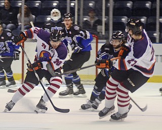 Katie Rickman | The Vindicator.Phantom's Ryan Lomberg, on left moves up the ice as Mullari (#27) guards him and keeps Lincoln Stars Blake Christensen (#28) back during the first period at the Covelli Centre on Sunday, Nov. 16, 2014. Phantoms lost to the Lincoln Stars 3-4 in over time.