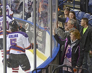 Katie Rickman | The Vindicator.Fans meet the Phantoms around the edge of the rink in support after the loss against the Lincoln Stars in overtime 3-4 on Sunday, Nov. 16, 2014.
