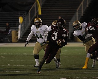  .          ROBERT  K. YOSAY | THE VINDICATOR..iberty #3 Ben Phillips breaks out of the backfield during first quarter action as ursulines #44Spencer Warren and #14 (hidden) Dakota Hobbs give chase.. Blocking #4 Libertys Kaylon Davis  on #10 Dawalyn Washington for Ursuline..Ursuline Irish vs Liberty Leopards at Mollenkof Stadium...-30-