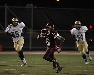  .          ROBERT  K. YOSAY | THE VINDICATOR..Libertys #6 Lynn Bowden breaks out in the open as Ursulines #55 Giacamo Cappablanca and #54 Tyler Leonard chase.. as he got a first down..Ursuline Irish vs Liberty Leopards at Mollenkof Stadium...-30-