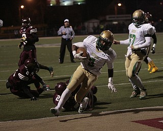  .          ROBERT  K. YOSAY | THE VINDICATOR..Ursulines #3 Kimauni Johnson runs into the endzone for the Irish first score on a three yard run  as #21 Junior Blair #2 JaShaun Whitman fall down   Uruslines #67 Dante Cerimele looks on..Ursuline Irish vs Liberty Leopards at Mollenkof Stadium...-30-