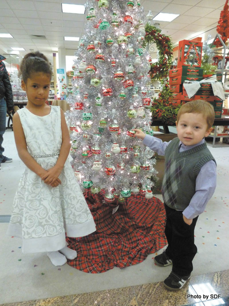 Amara DeVault and Landon Brown, models for the upcoming 45th annual champagne luncheon and fashion show hosted by GFWC Ohio Warren Junior Women’s League, had fun trying on the outfits they will wear on the runway. The children attend Children’s Rehabilitation Center in Howland, the major benefactor of the annual luncheon. The event, with the theme “We’re Dreaming of a White Christmas,” will take place Friday at W.D. Packard Music Hall in Warren, and the cost is $65. For tickets call Renee Maiorca at 330-307-1694 or email gfwcohiowjwl@gmail.com. SPECIAL TO THE VINDICATOR

