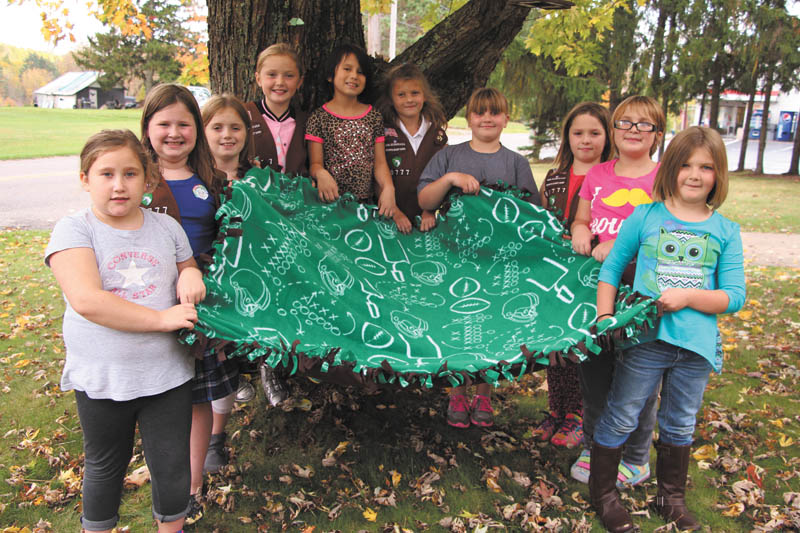 SPECIAL TO THE VINDICATOR  At a recent meeting, Girl Scout Troop 80777 of Columbiana made two blankets to donate to veterans. The blankets were made as part of a collection effort on behalf of St. Paul Church in Salem. The 10 girls in the troop range from Daisies to Brownies, and all attend Joshua Dixon Elementary School. Troop leaders are Crystal Siembida Boggs and Kathy Kaszowski. The girls are, from left to right, Emily Smith, Katrina Kaszowski, Alaina Johnston, Vivian Jeffries, Mia Surgenavic, Madison Walkama, Alyssa Kakavros, Elizabeth Siembida, Lea Joy and Nina Jester.