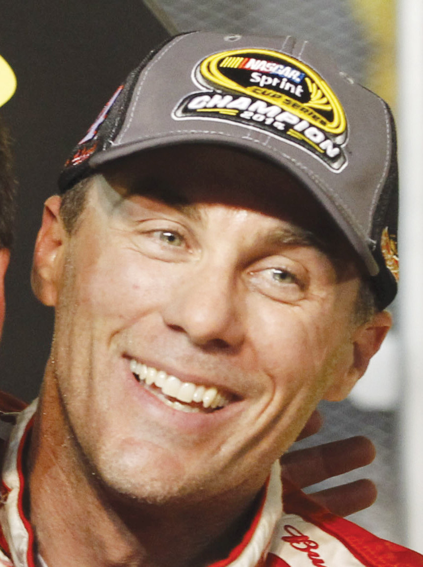Kevin Harvick celebrates winning the NASCAR Sprint Cup championship series auto race, Sunday, Nov. 16,2014 in Homestead, 