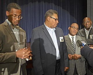 Katie Rickman | The  Vindicator.Local PastorÕs L-R Kenneth Donaldson of Rising Star Baptist Church, Julius Davis of Friendship Baptist Church in Girard, Ernest Ellis of Antioch Baptist Church, and deacon Lloyd Hughes of Rising Star Baptist Church speak to press about their presence at East High School and the grief counseling they provided for students on Thursday, Nov. 13, 2014 after the freak accidental death of freshman Faith McCullough-Wooster the day before.