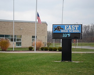 Katie Rickman | The  Vindicator.The flag at East High School flies at half at half staff Thursday, Nov. 13, 2014 the day after the death of freshman Faith McCullough-Wooster.