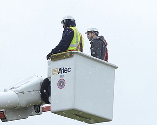 Katie Rickman | The Vindicator.Brandon Durig (on left), an experienced Ohio Edison worker takes Dominic Fronzaglio, 18, of Vienna up in a bucket truck during a training demonstration at Kent State University Trumbull campus on Friday, Nov. 14, 2014.  Fronzaglio is a senior at Matthews High School and is considering trying out for the program at KSU Trumbull.