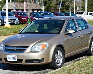 A 2005 Chevrolet Cobalt is parked outside a dealership in Alexandria, Va. Cobalts were among the millions of vehicles recalled by General Motors. Arizona’s attorney general has sued General Motors for failing to recall cars and trucks with safety defects the auto giant did not disclose for years. The lawsuit seeks potentially billions of dollars in fines.